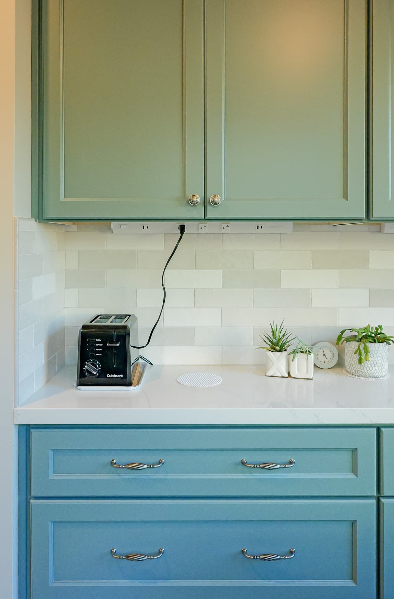 Kitchen Remodel in Sacramento — two-tone cabinetry, raised-panel cabinets, subway tile backsplash, quartz countertop, under-cabinet lighting