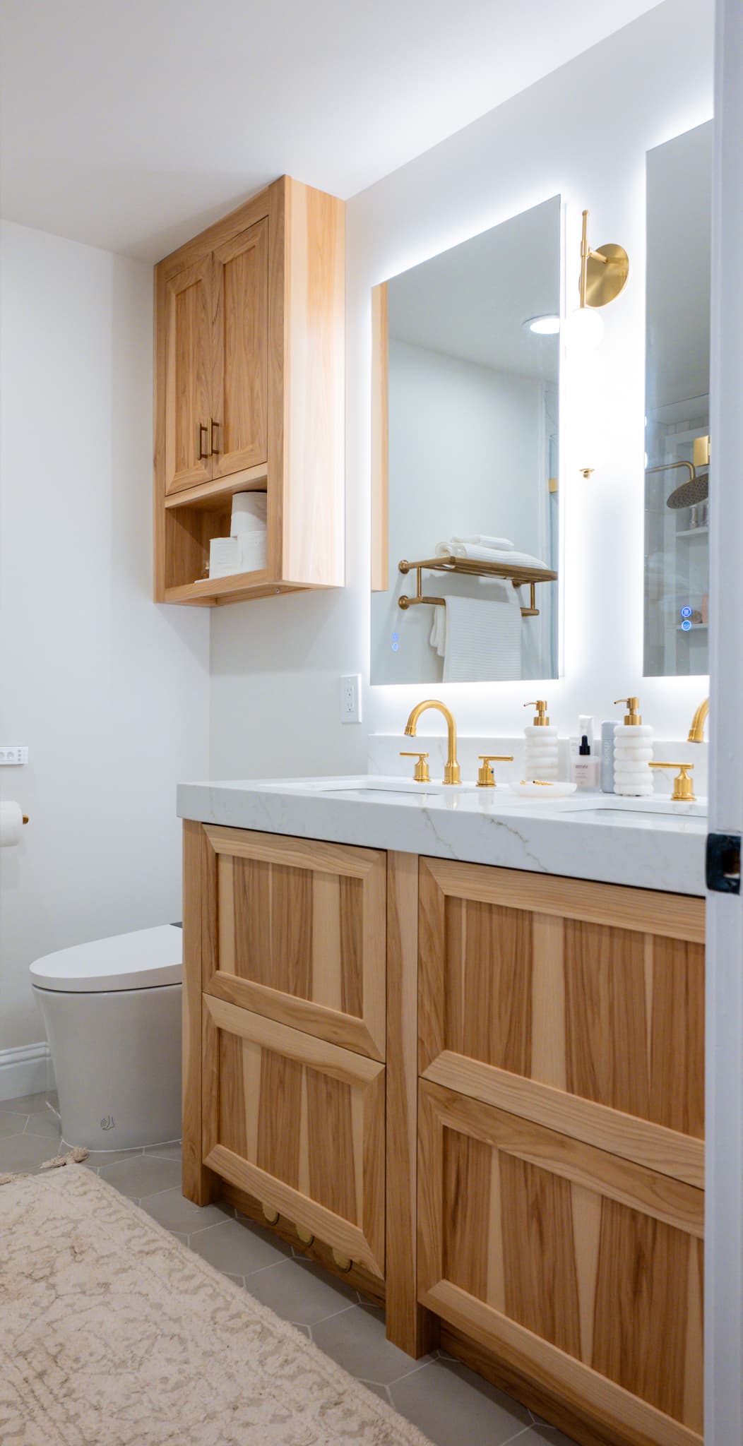Kitchen Remodel in Sacramento — custom cabinetry, lighted mirror, single vanity, undermount sink, marble countertop