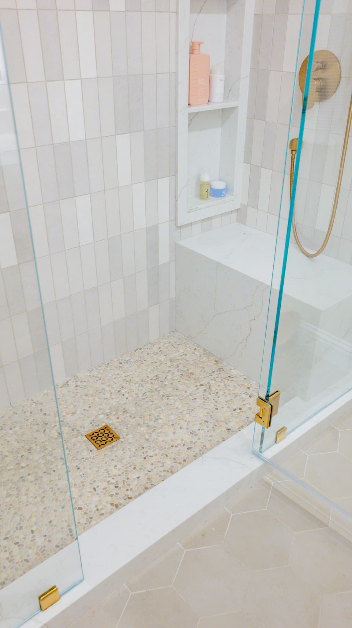 Kitchen Remodel in Sacramento — frameless glass shower, tiled shower surround, shower bench, handheld shower, mosaic backsplash