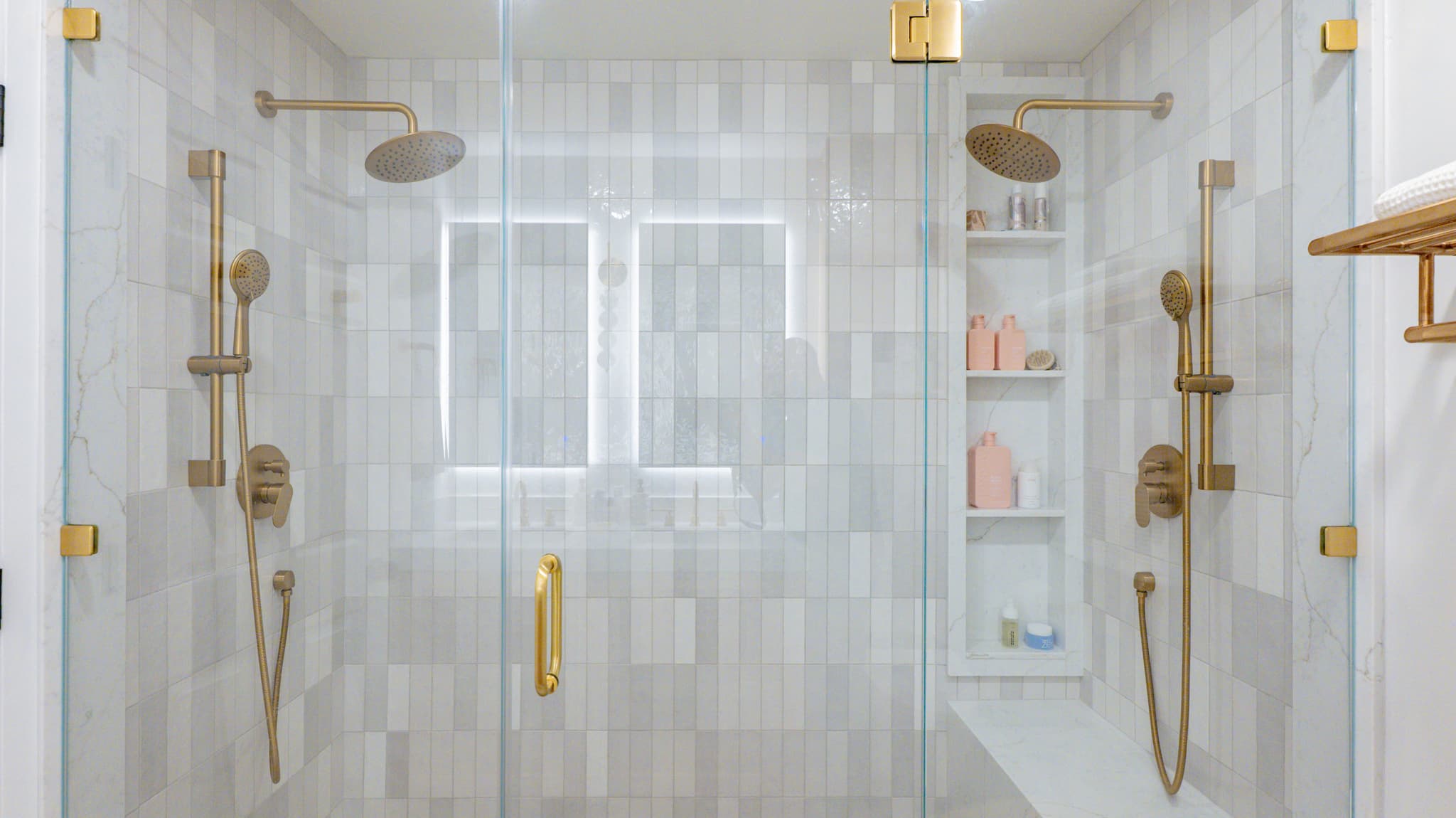 Kitchen Remodel in Sacramento — frameless glass shower, rain shower head, handheld shower, tiled shower surround, shower bench