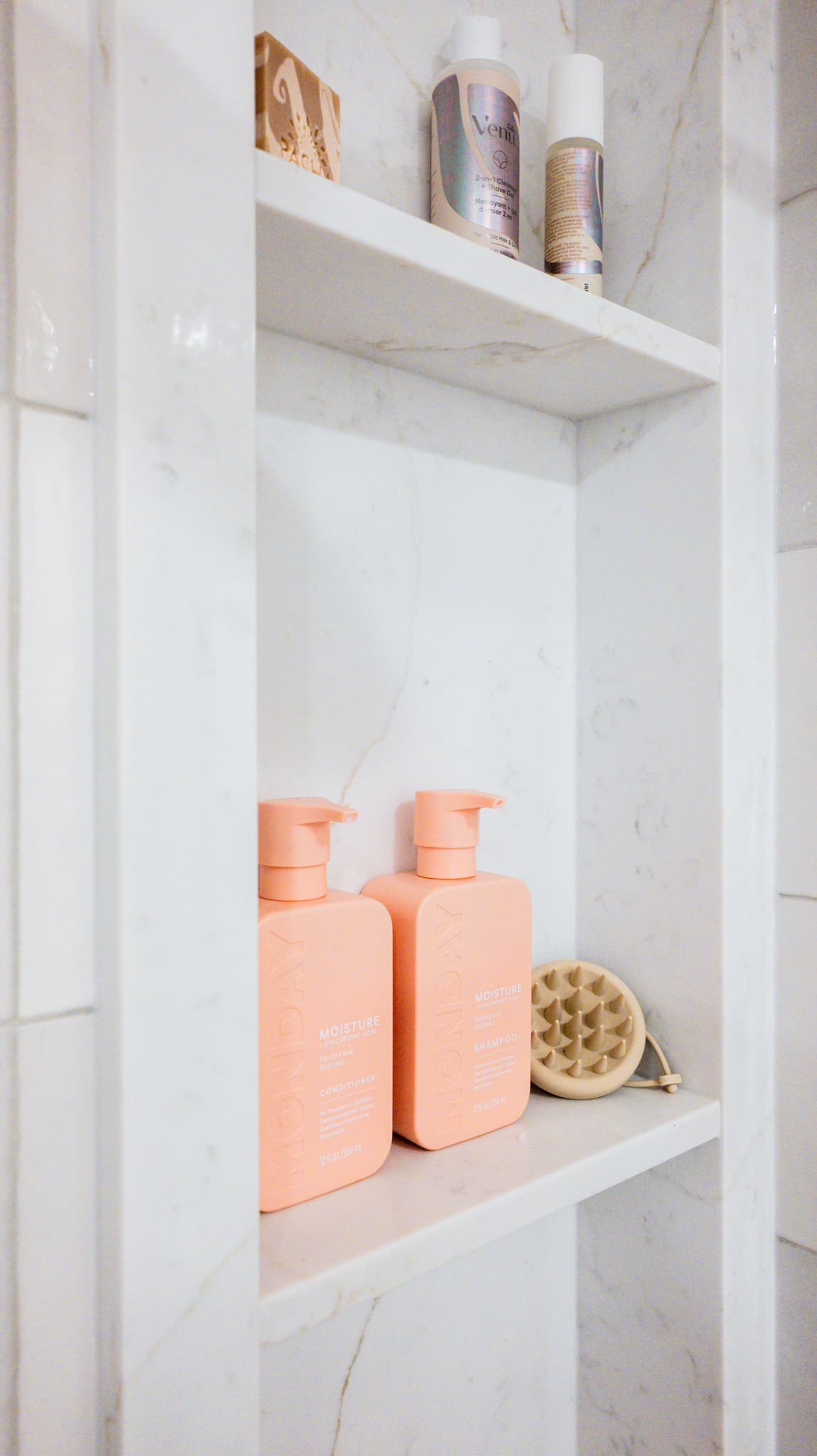 Kitchen Remodel in Sacramento — walk-in shower, tiled shower surround, marble tile flooring, built-in shelving, natural-stone backsplash