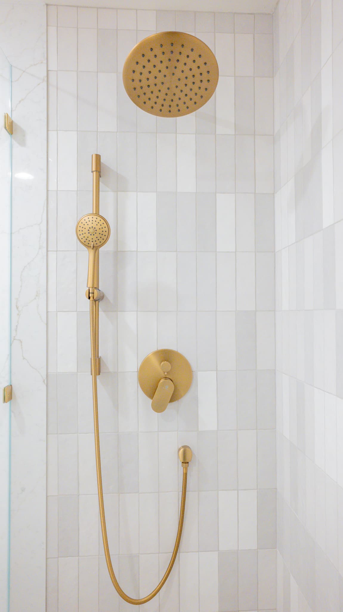 Kitchen Remodel in Sacramento — walk-in shower, frameless glass shower, tiled shower surround, rain shower head, handheld shower