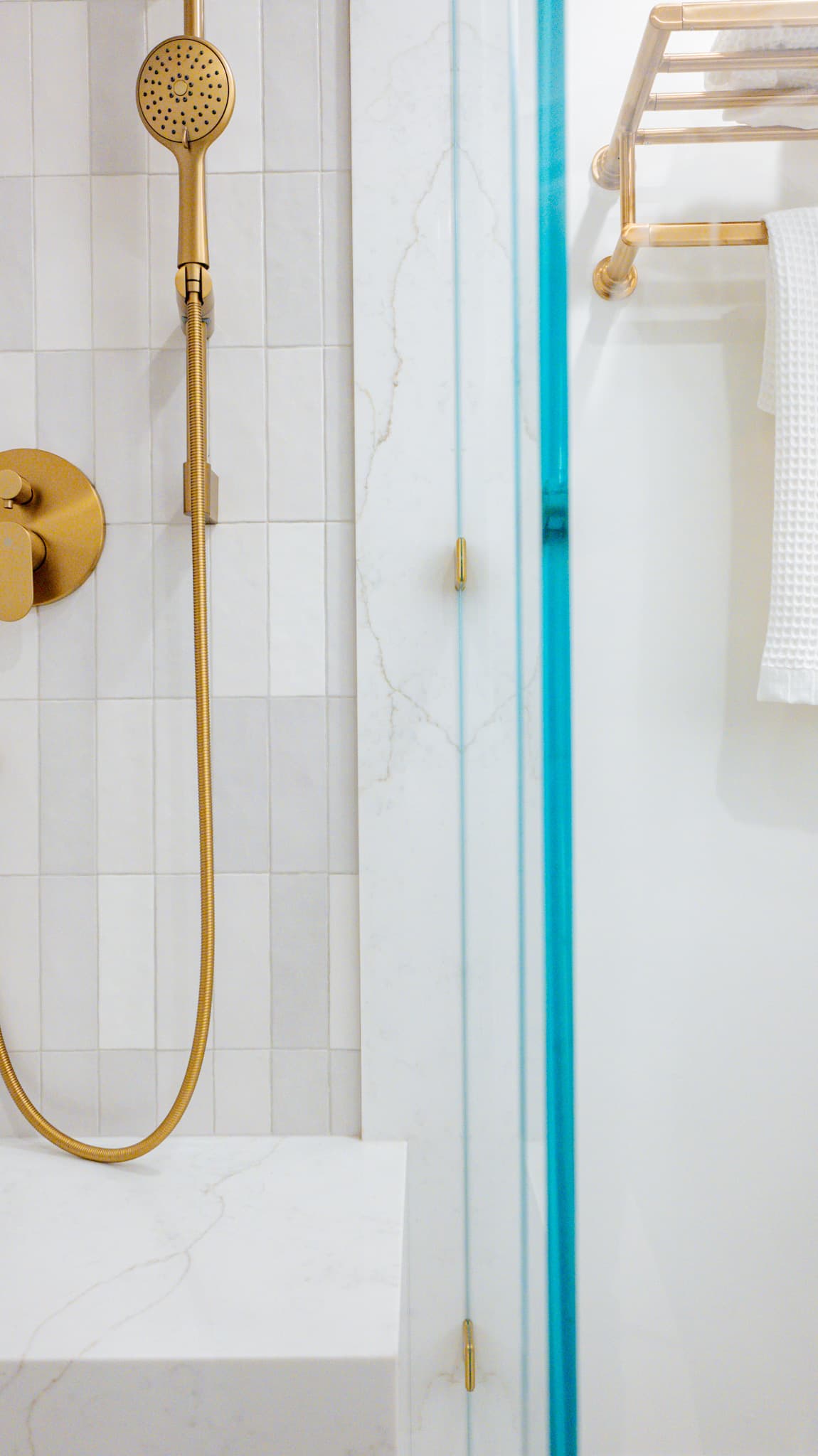 Kitchen Remodel in Sacramento — frameless glass shower, handheld shower, tiled shower surround, walk-in shower, natural-stone tile flooring