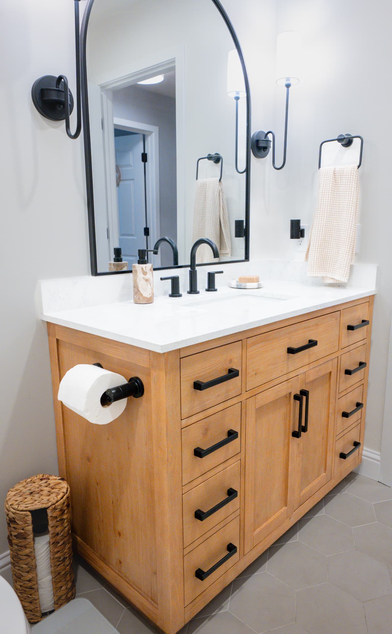 Kitchen Remodel in Sacramento — single vanity, quartz countertop, framed mirror, shaker cabinets, ceramic tile flooring