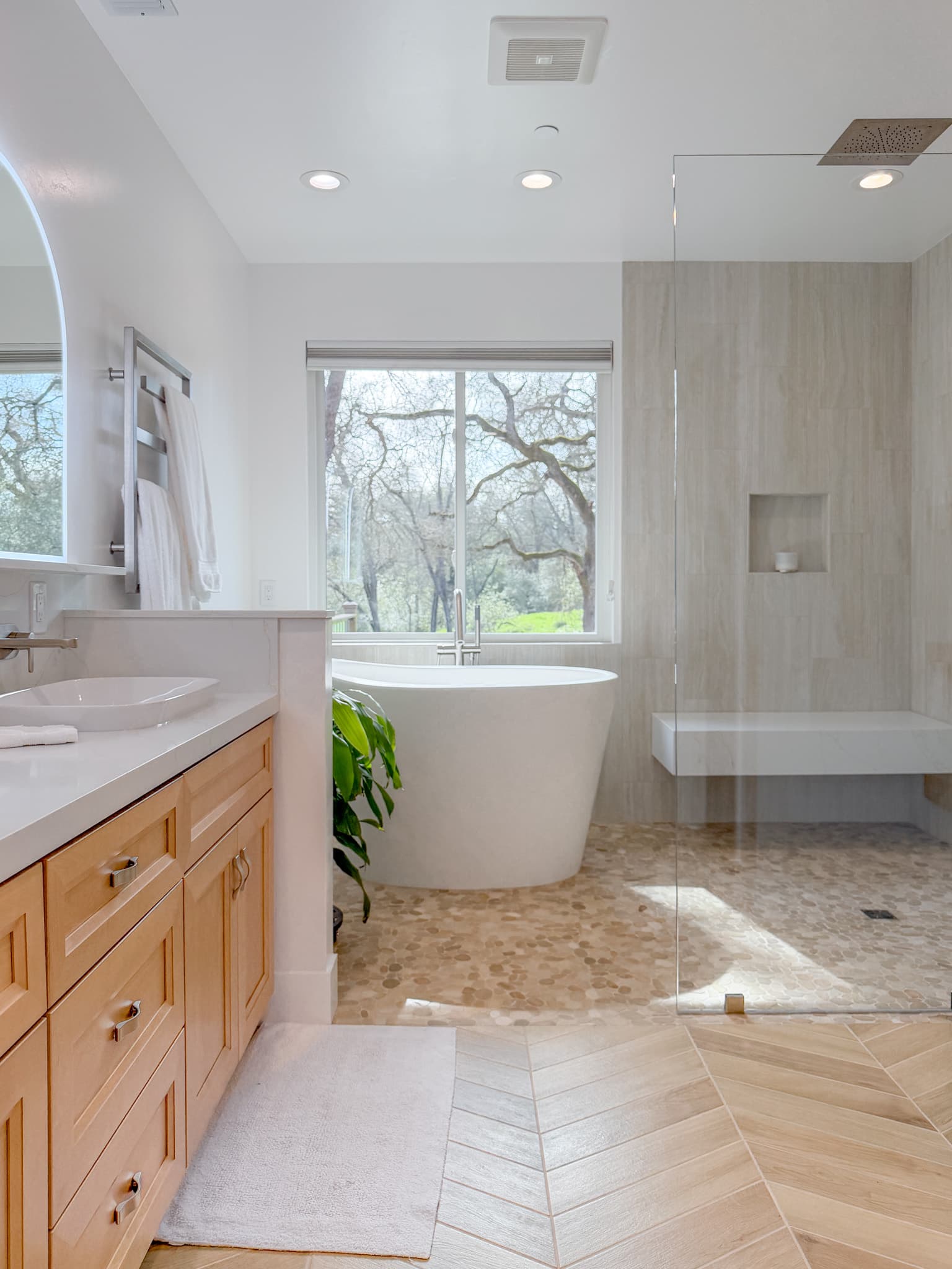Bathroom Remodel in Carmichael — freestanding tub, frameless glass shower, shower bench, rain shower head, recessed lighting