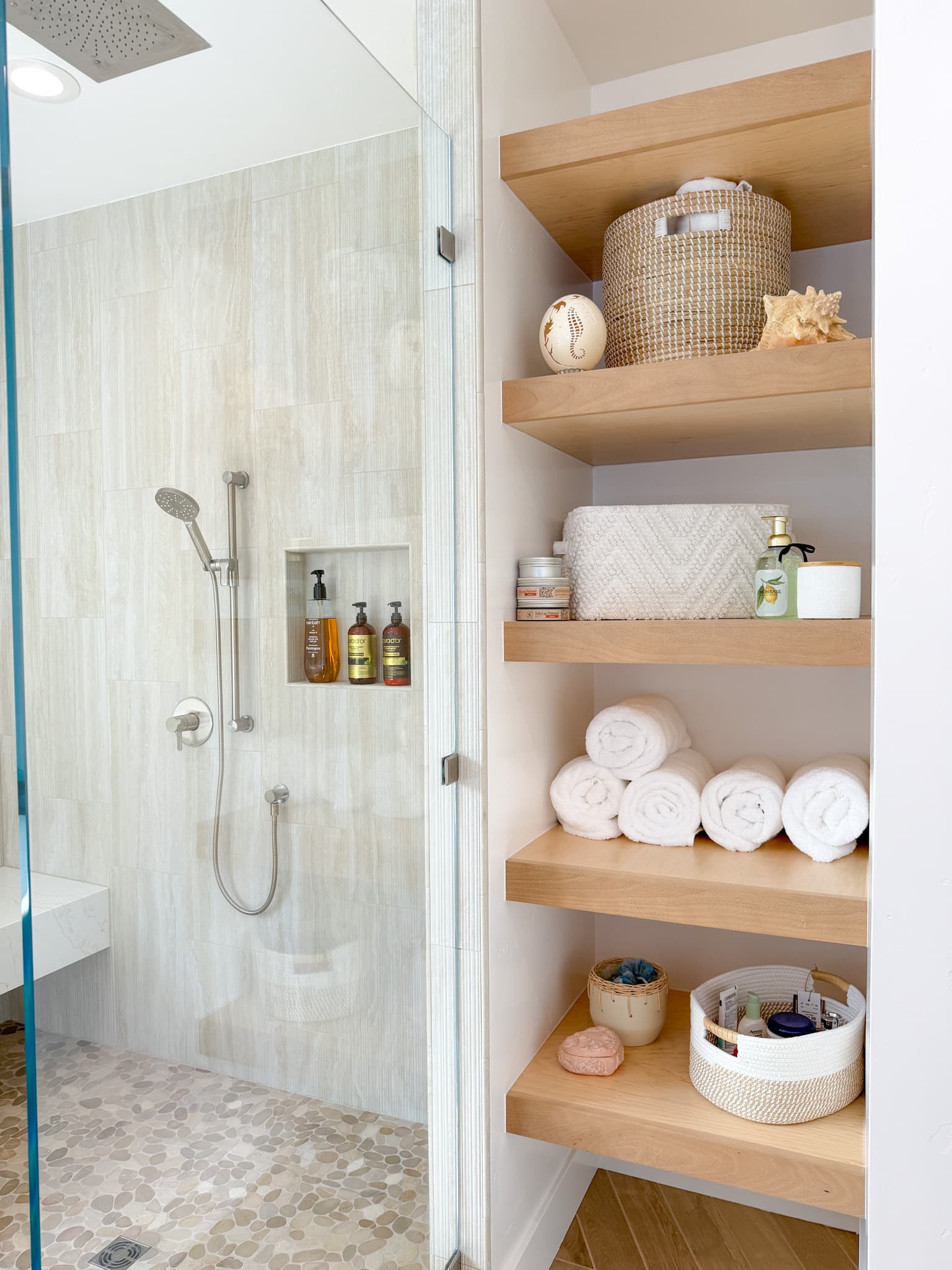 Bathroom Remodel in Carmichael — frameless glass shower, tiled shower surround, handheld shower, shower bench, built-in shelving