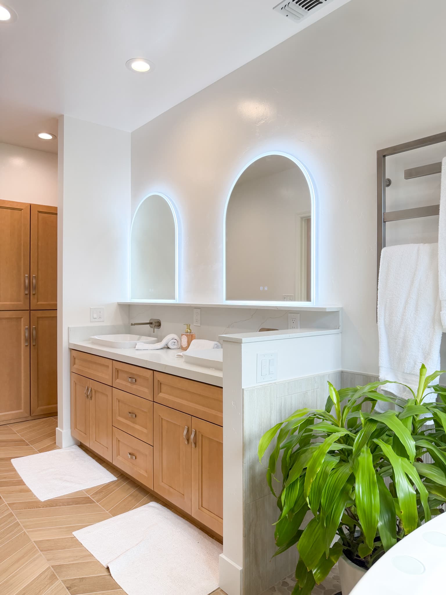 Bathroom Remodel in Carmichael — double vanity, lighted mirror, quartz countertop, raised-panel cabinets, recessed lighting