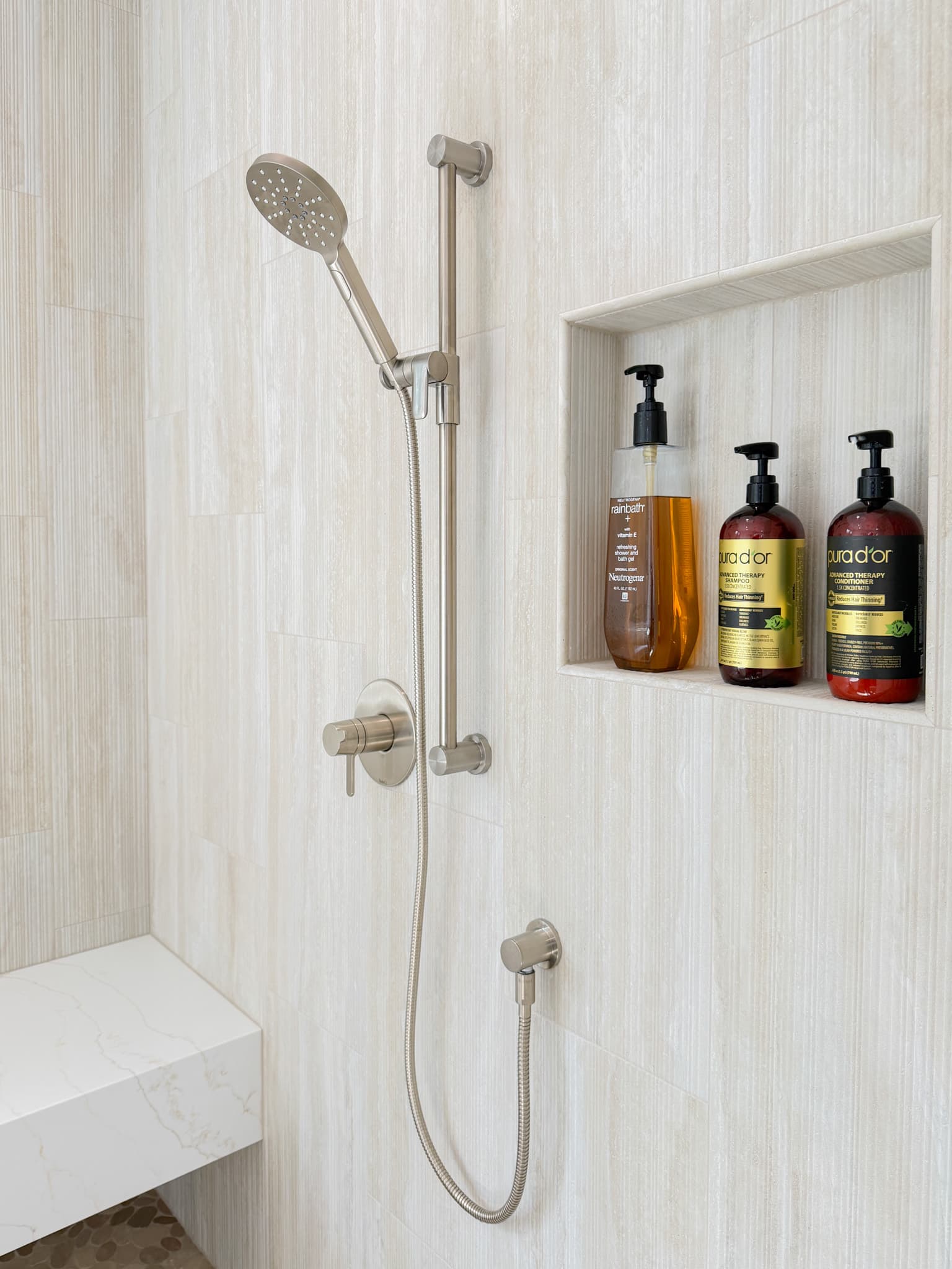 Bathroom Remodel in Carmichael — tiled shower surround, handheld shower, shower bench, walk-in shower, built-in shelving