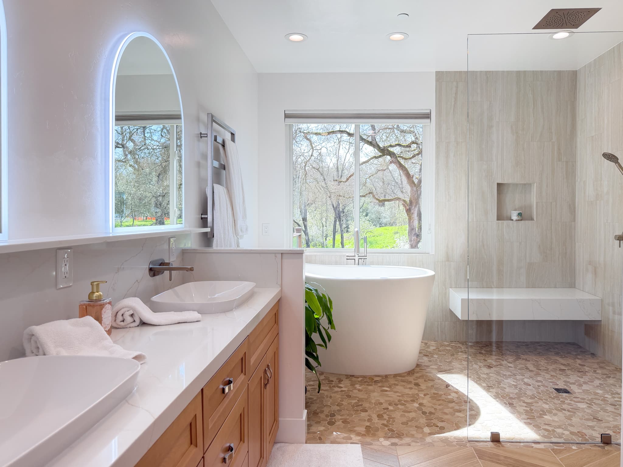 Bathroom Remodel in Carmichael — freestanding tub, frameless glass shower, double vanity, vessel sink, lighted mirror