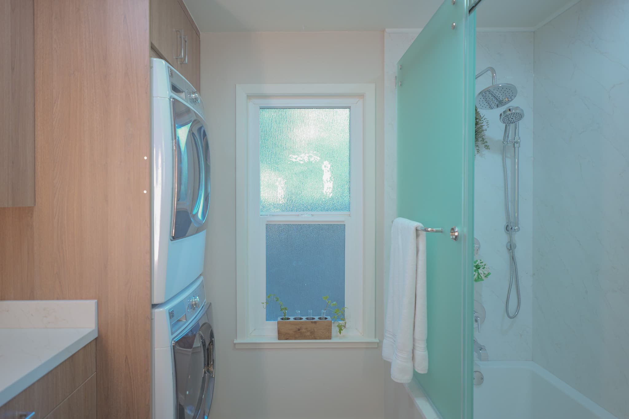 House Renovation in Sacramento — frameless glass shower, rain shower head, handheld shower, custom cabinetry, walk-in shower