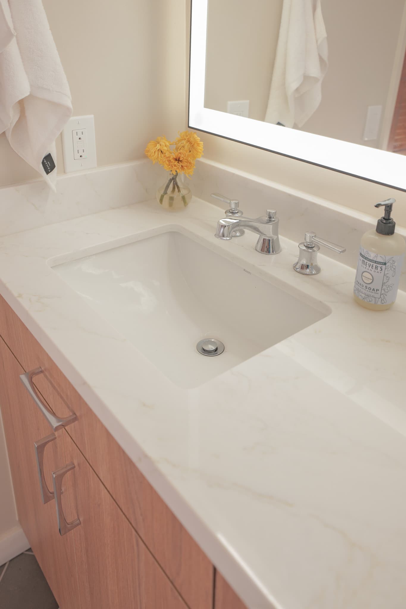 House Renovation in Sacramento — undermount sink, quartz countertop, floating vanity, lighted mirror, single vanity