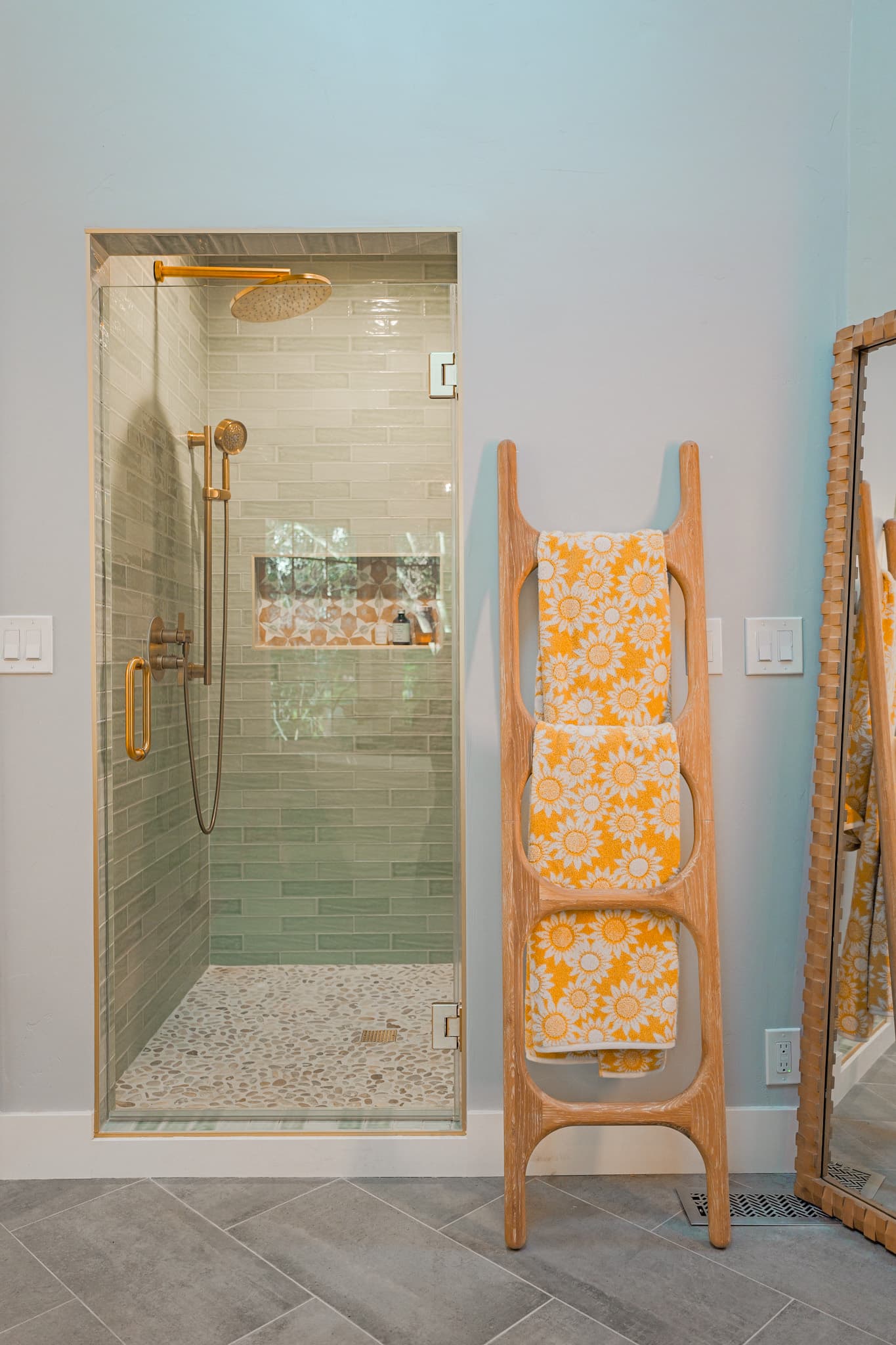 House Renovation in Sacramento — frameless glass shower, tiled shower surround, rain shower head, handheld shower, porcelain tile flooring