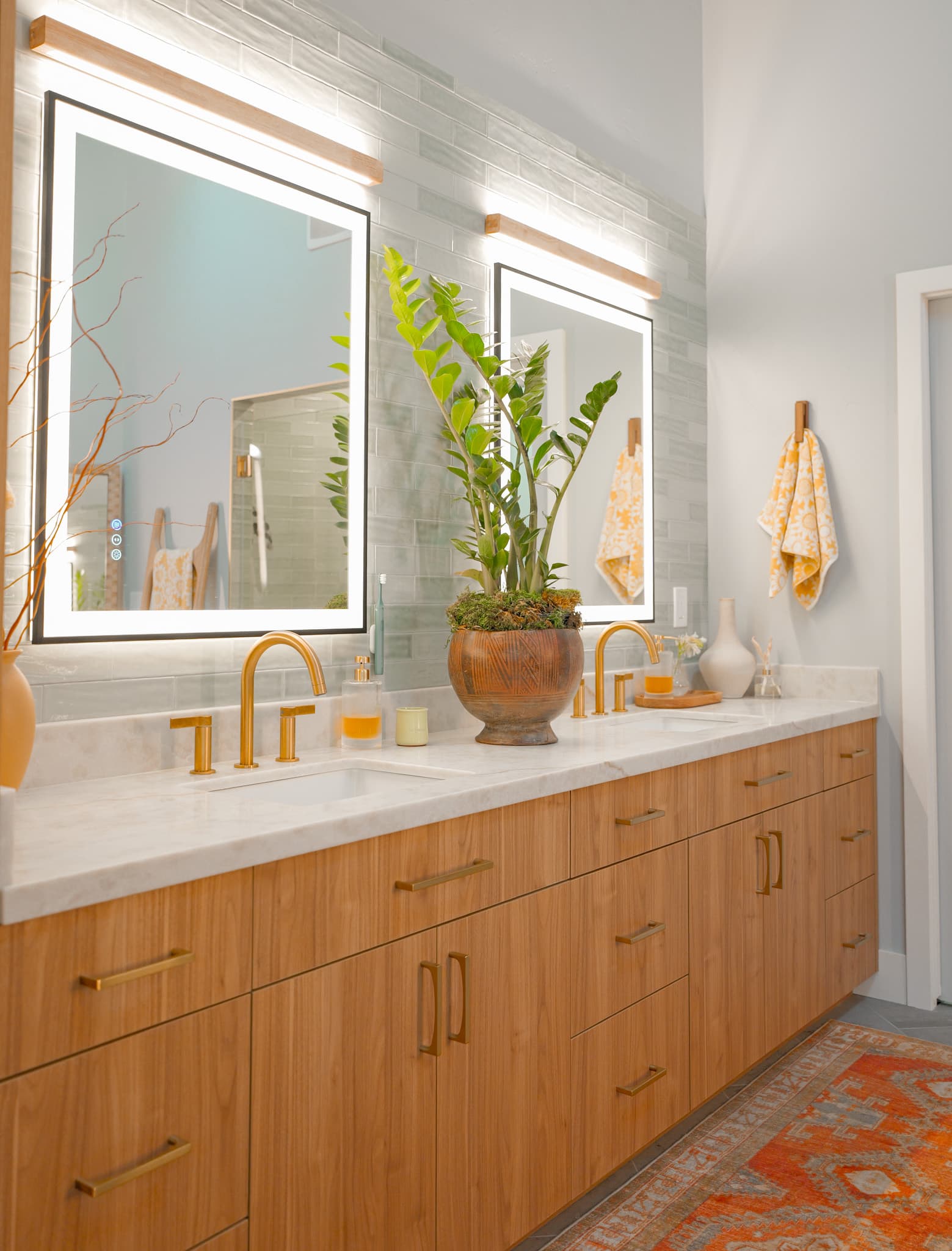House Renovation in Sacramento — double vanity, lighted mirror, undermount sink, quartz countertop, custom cabinetry