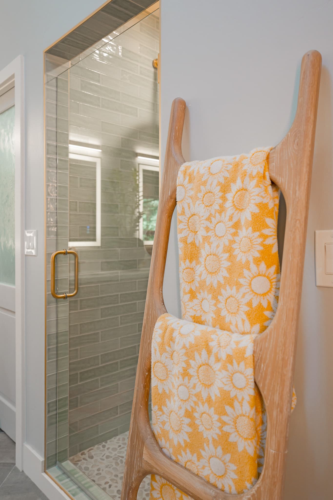 House Renovation in Sacramento — walk-in shower, frameless glass shower, tiled shower surround, natural-stone tile flooring, subway tile backsplash