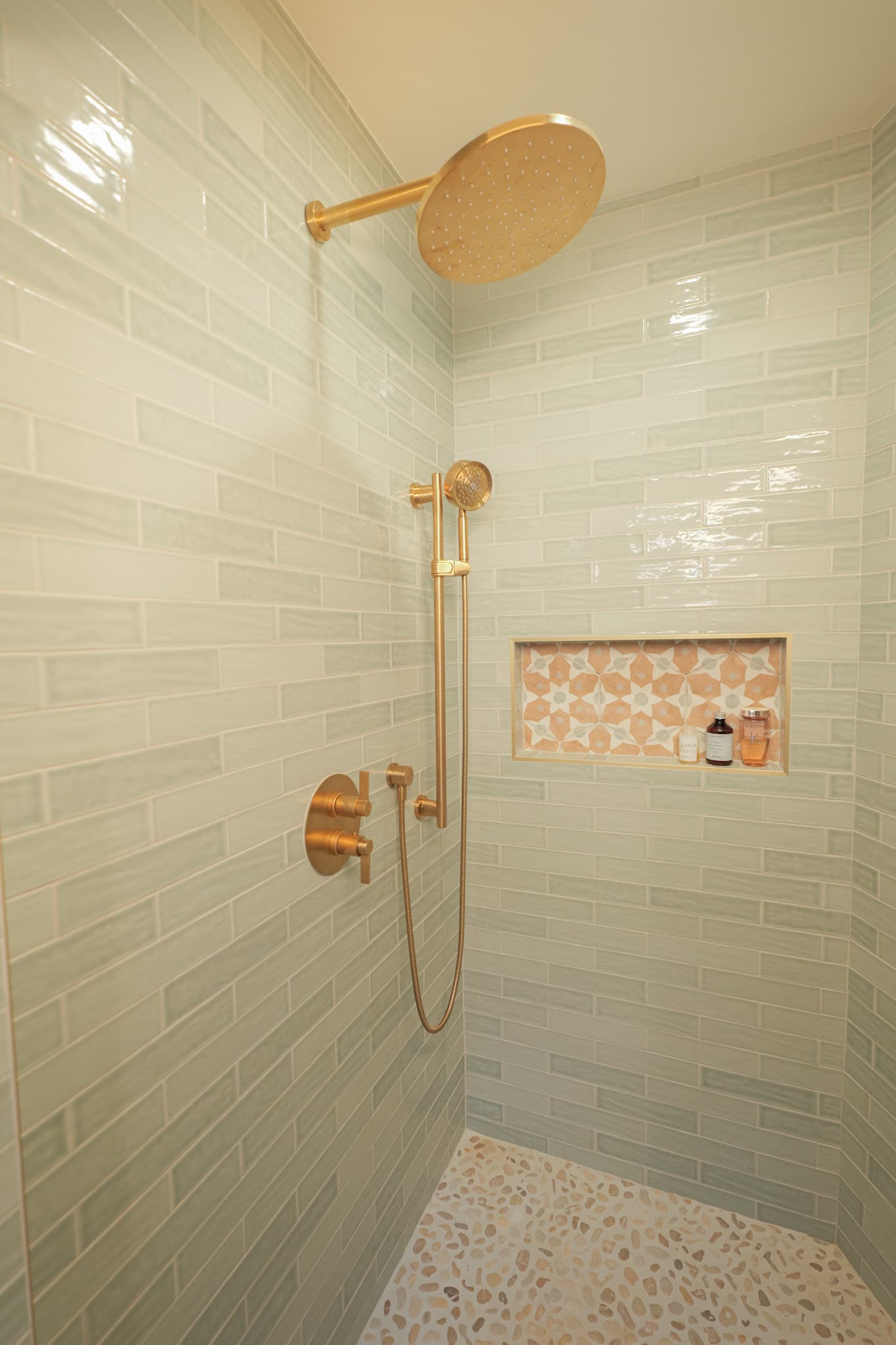 House Renovation in Sacramento — walk-in shower, rain shower head, handheld shower, tiled shower surround, mosaic backsplash