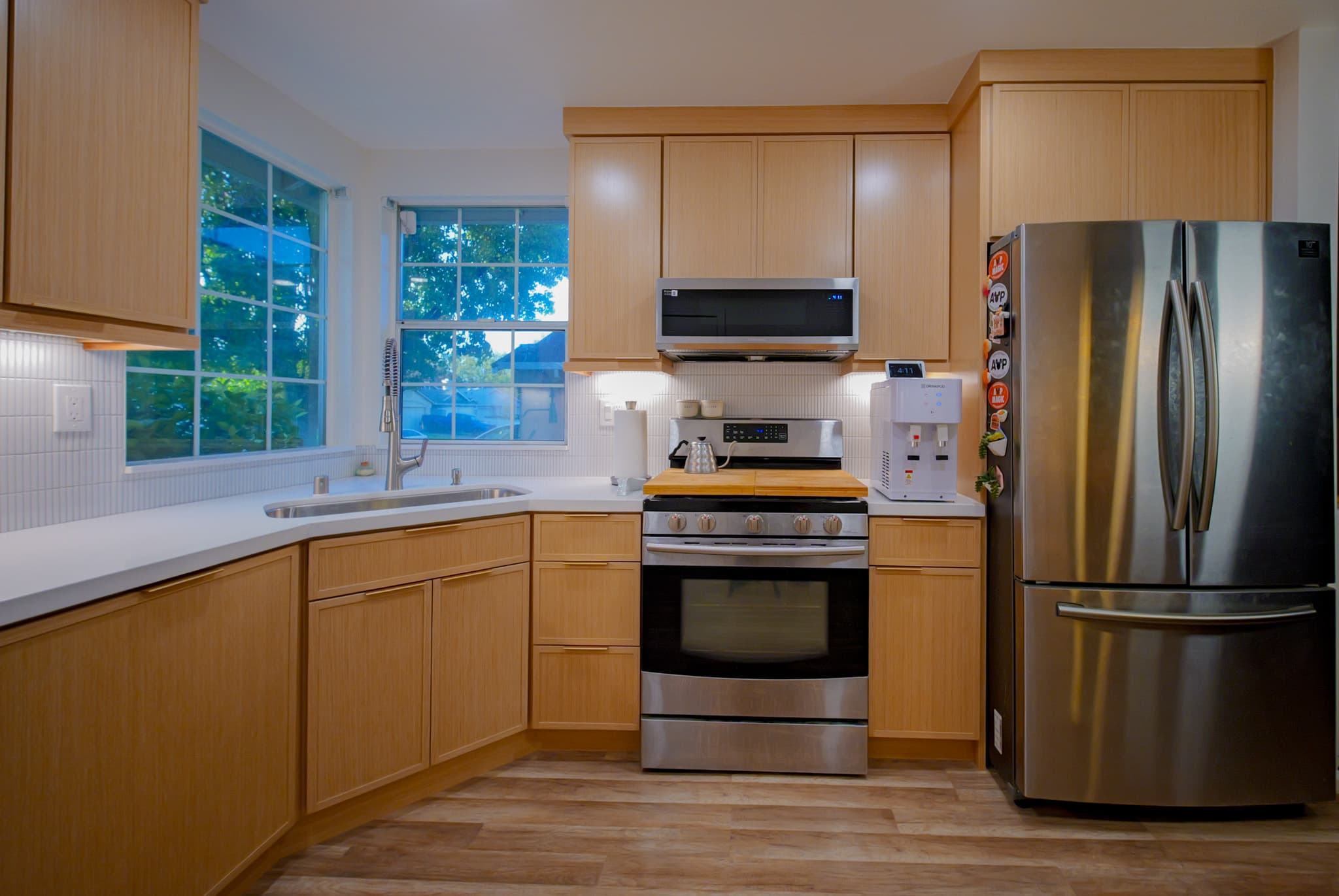 Kitchen Remodel in Antelope — shaker cabinets, stainless appliances, undermount sink, under-cabinet lighting, luxury vinyl plank
