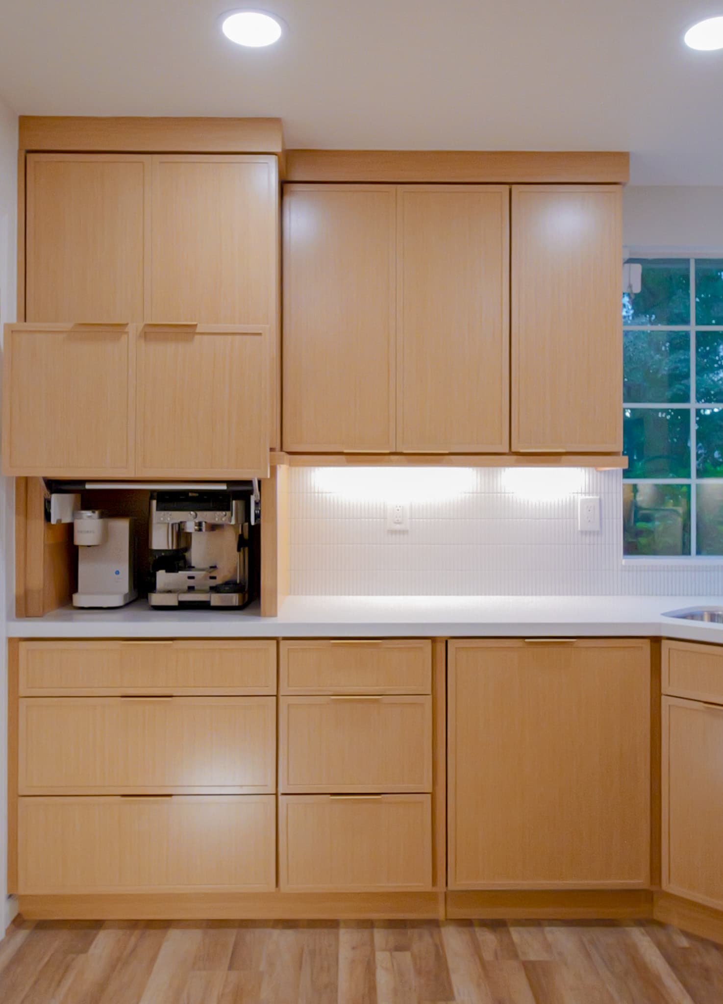 Kitchen Remodel in Antelope — custom cabinetry, recessed lighting, under-cabinet lighting, quartz countertop, luxury vinyl plank