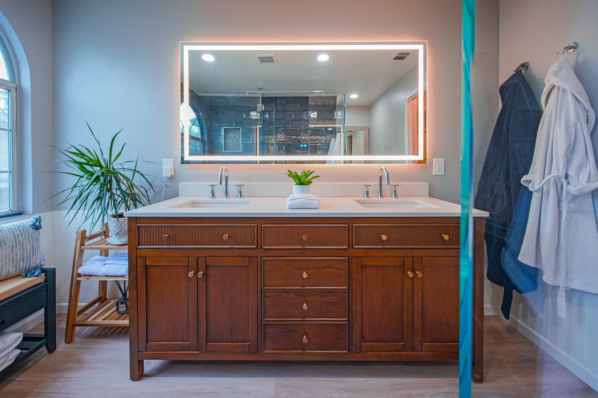 Bathroom Remodel in Sacramento — double vanity, lighted mirror, undermount sink, quartz countertop, luxury vinyl plank