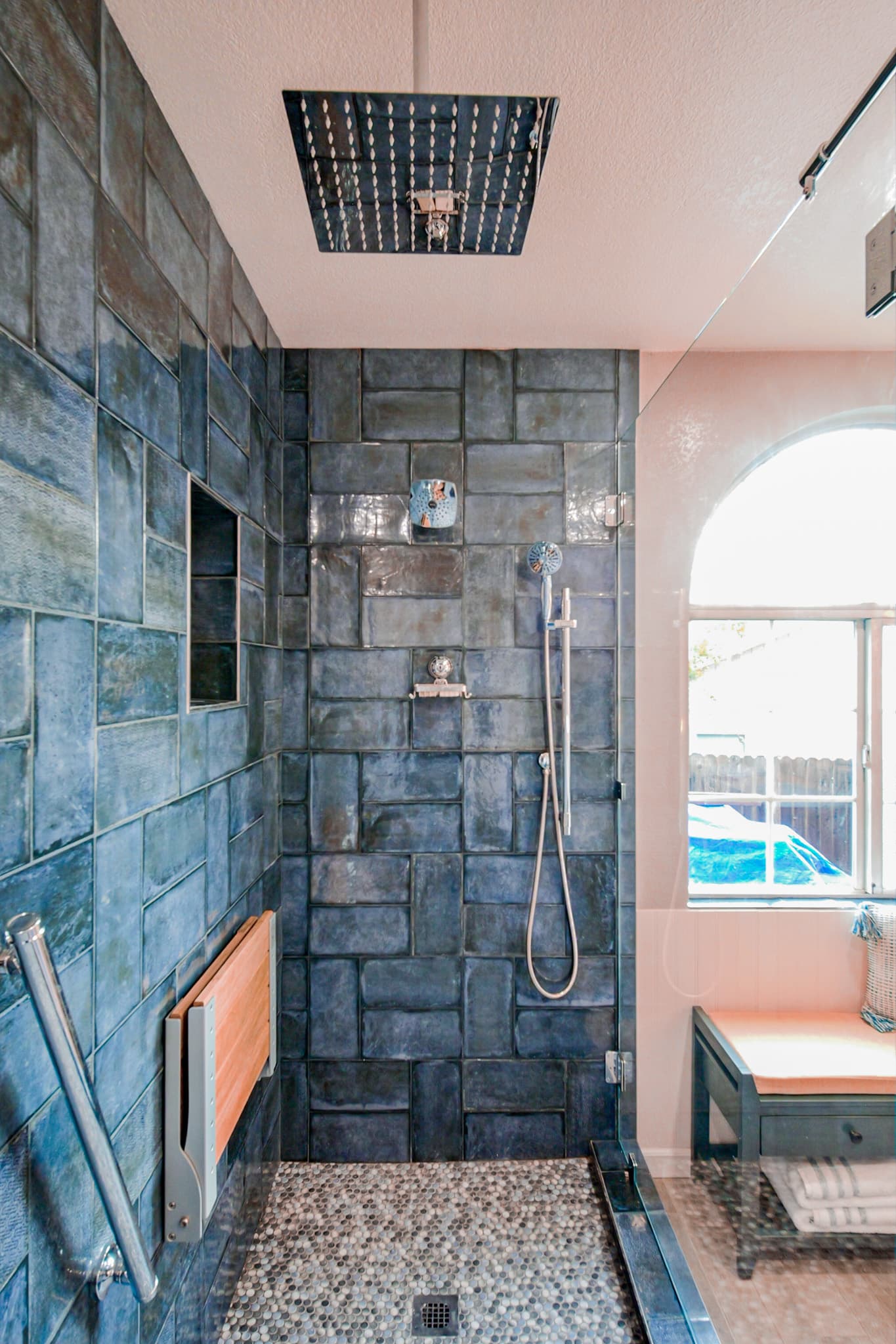 Bathroom Remodel in Sacramento — walk-in shower, tiled shower surround, rain shower head, handheld shower, shower bench
