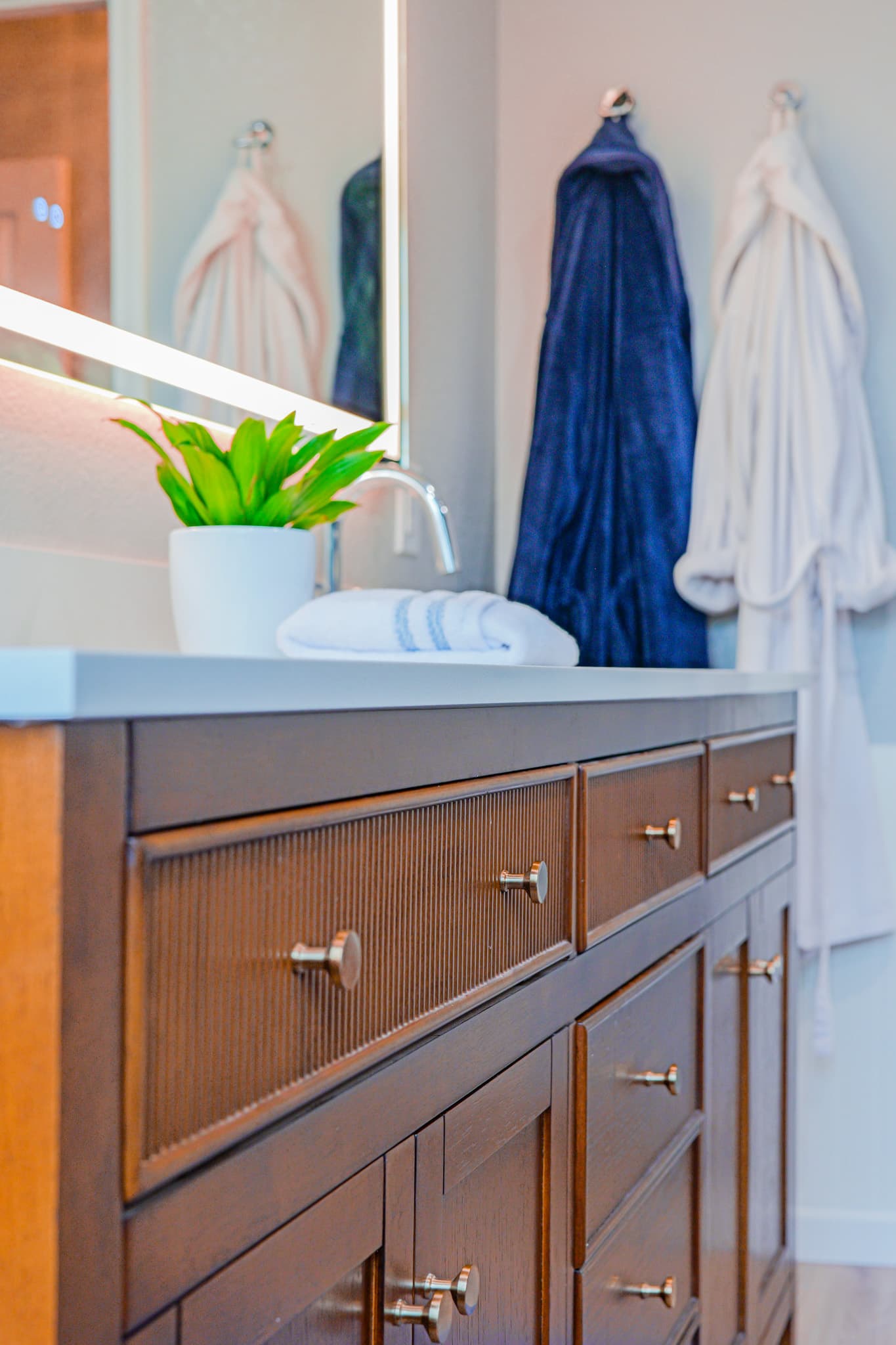 Bathroom Remodel in Sacramento — custom cabinetry, double vanity, lighted mirror, quartz countertop, undermount sink