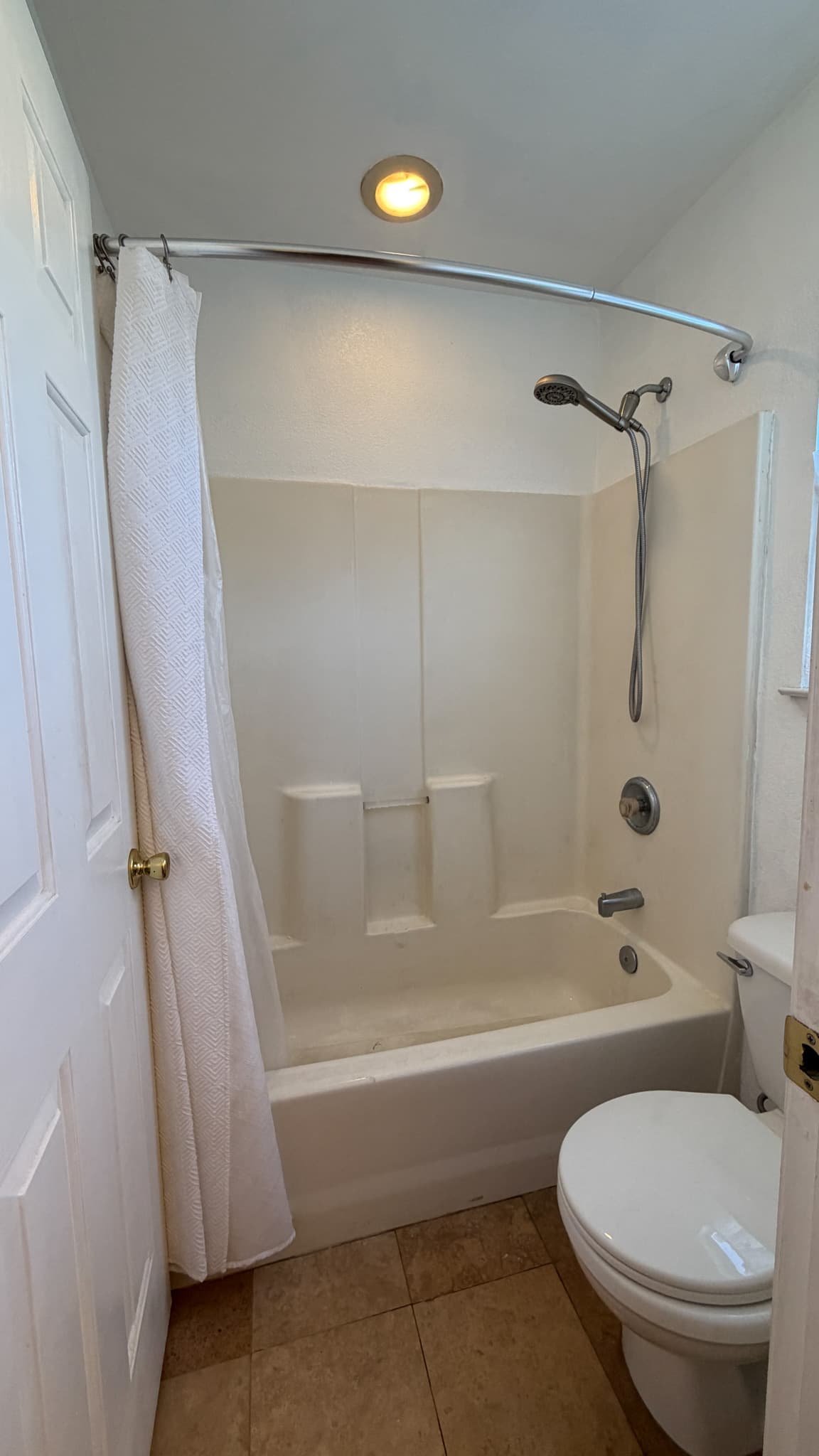 Bathroom Remodel in Sacramento — before remodel — original finishes, handheld shower, recessed lighting, ceramic tile flooring, soaking tub
