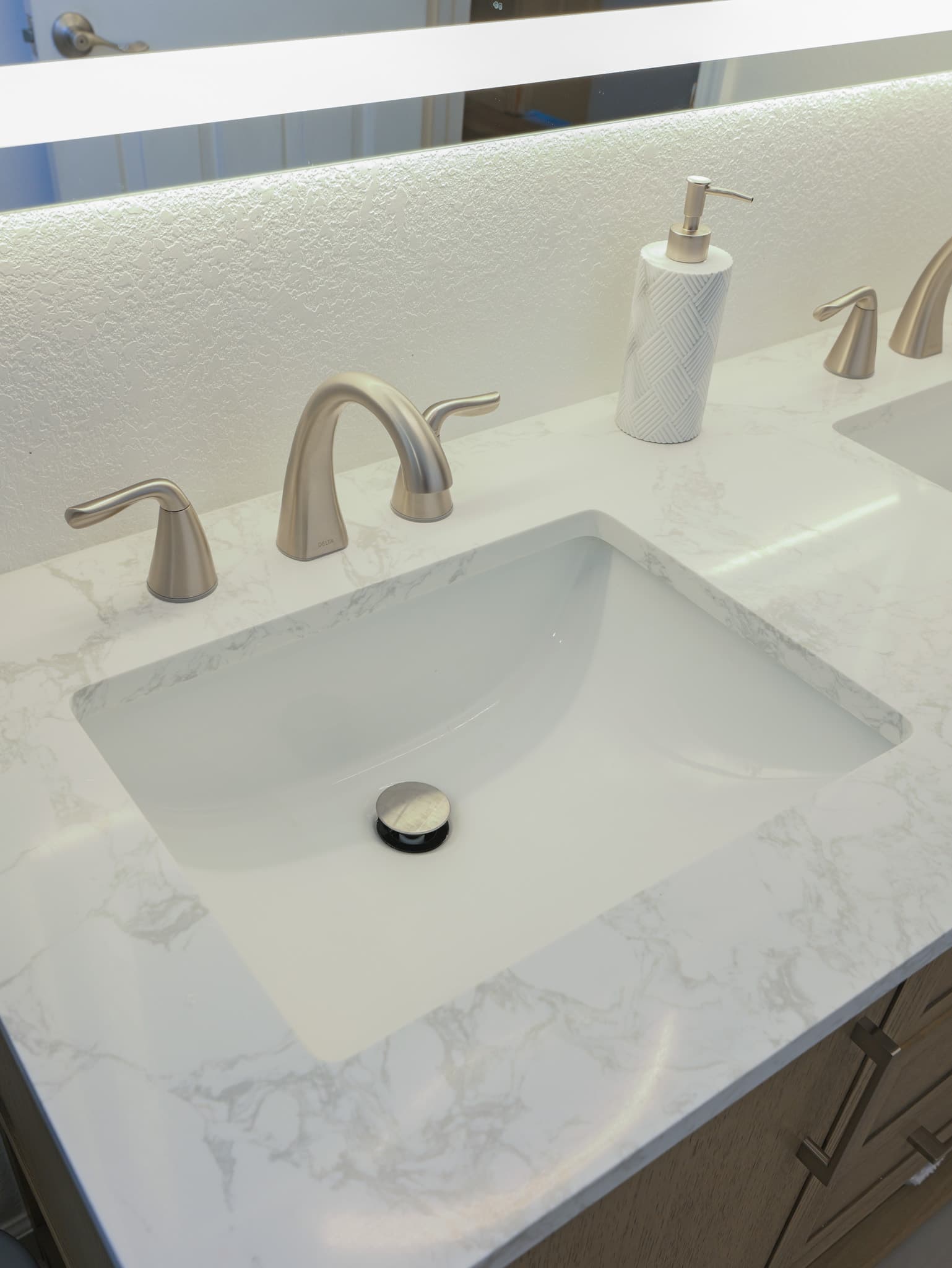 Bathroom Remodel in Sacramento — double vanity, undermount sink, quartz countertop, lighted mirror, shaker cabinets