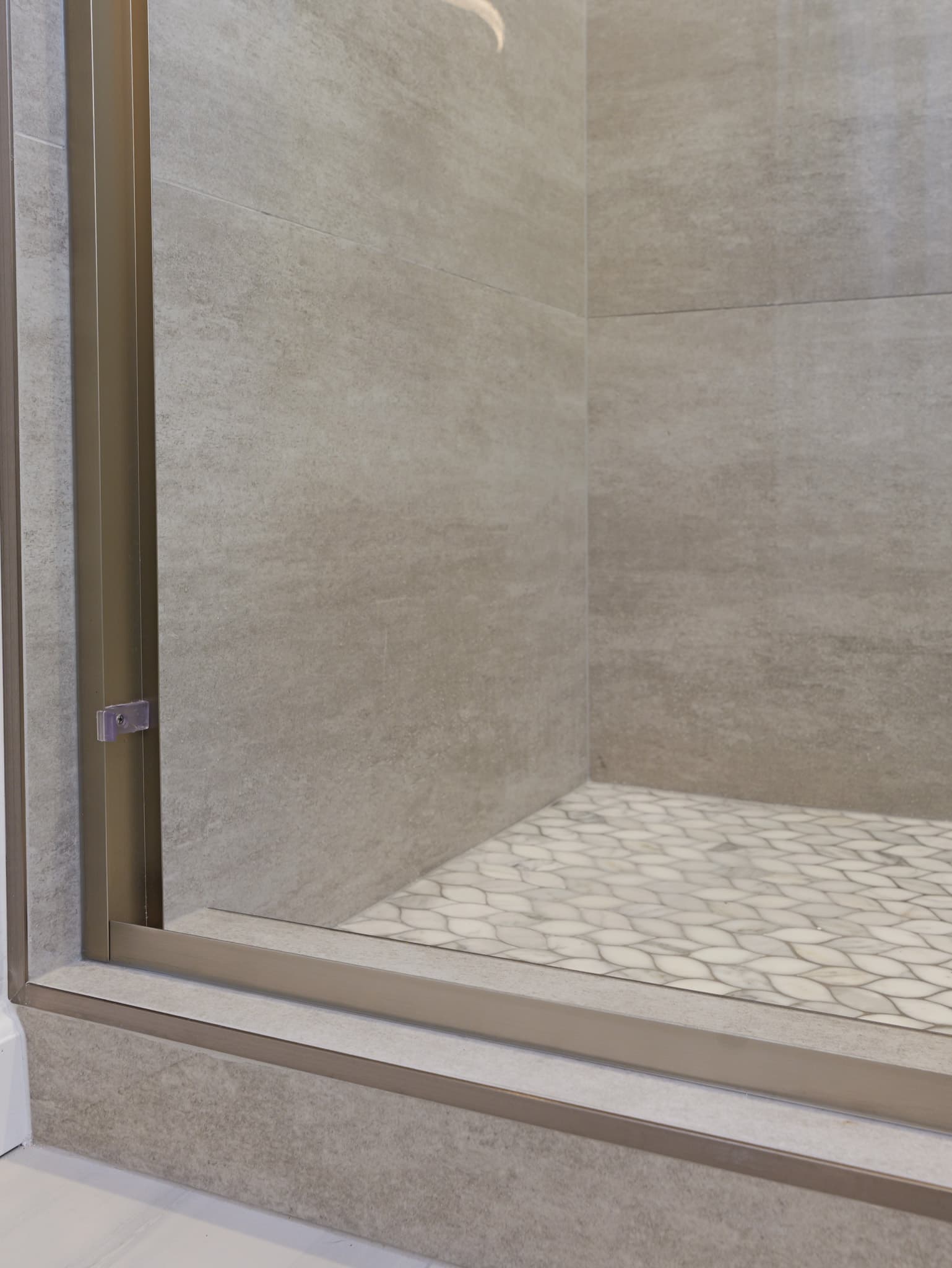 Bathroom Remodel in Sacramento — walk-in shower, tiled shower surround, mosaic backsplash, frameless glass shower, porcelain tile flooring