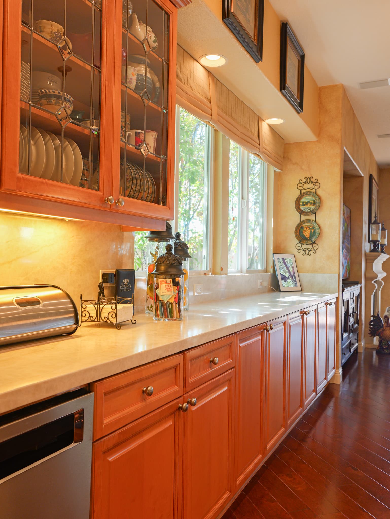 Kitchen Remodel in Roseville — raised-panel cabinets, recessed lighting, under-cabinet lighting, hardwood flooring, stainless appliances